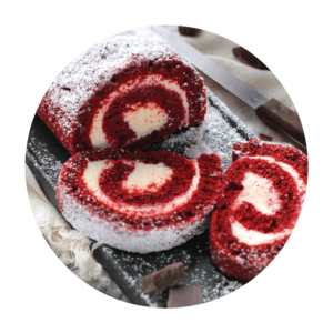 Featured Flavor - Joyful Traditions Red Velvet Cake Roll with two slices