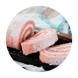 Featured Flavor - Joyful Traditions Strawberry Cheesecake Cake Roll with two slices