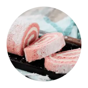 Featured Flavor - Joyful Traditions Strawberry Cheesecake Cake Roll with two slices