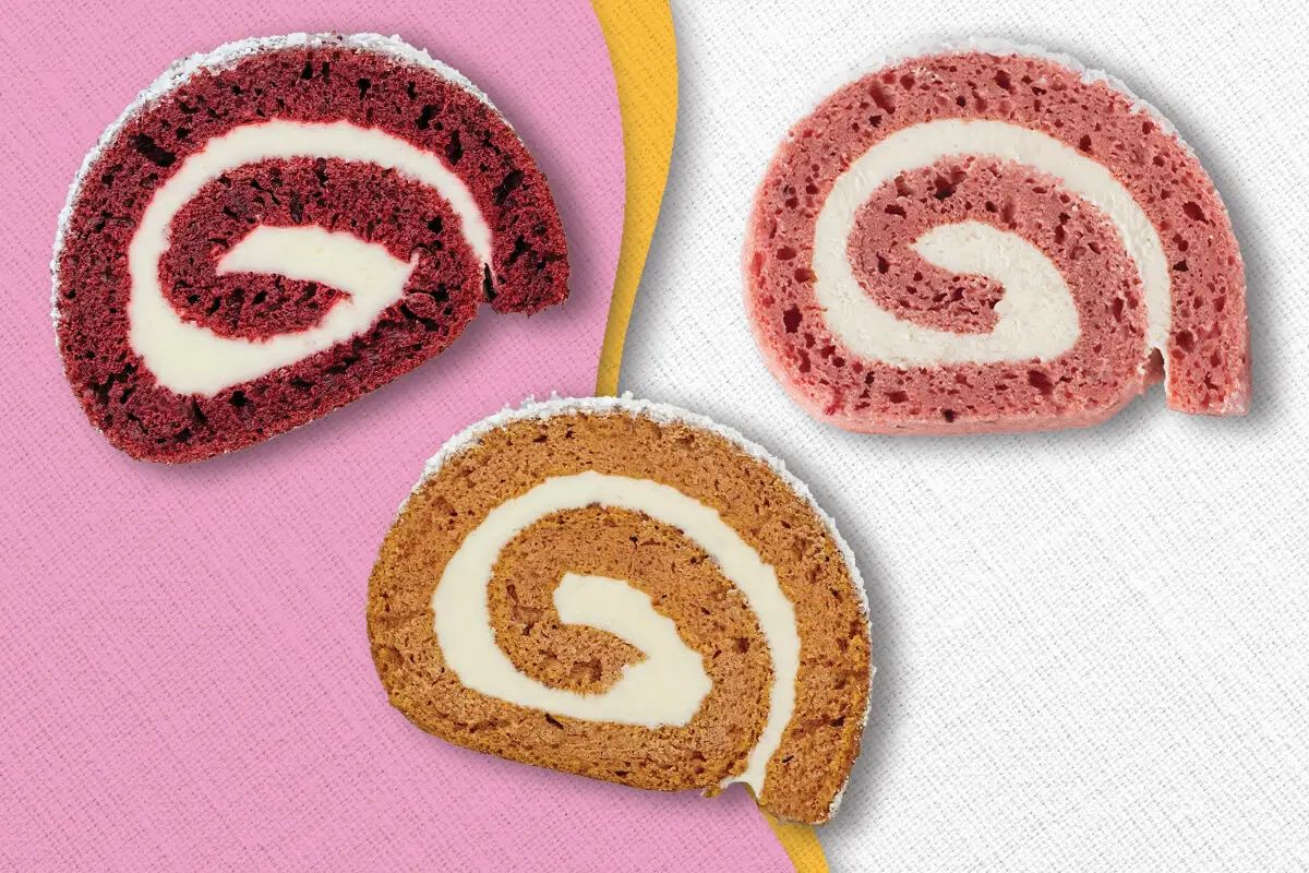 A slice of Red Velvet Cake Roll, a slice of Pumpkin Cake Roll, and a slice of Strawberry Cheesecake Cake Roll